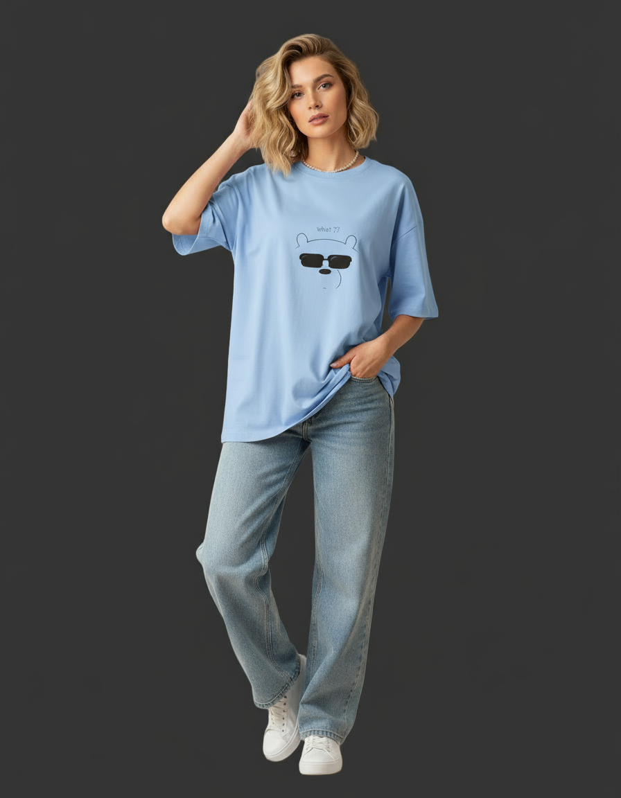 Woman wearing a pink t-shirt with a graphic design on a dark background